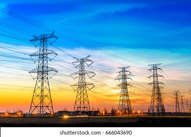 high voltage post,High voltage tower sky sunset background
