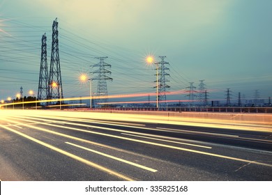high voltage post.High-voltage tower sky background,besides the highway - Shutterstock ID 335825168