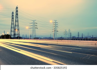 high voltage post.High-voltage tower sky background,besides the highway - Shutterstock ID 335825192