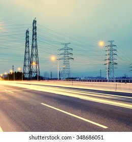 high voltage post.High-voltage tower sky background,besides the highway - Shutterstock ID 348686051