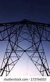 High voltage power pole with blue sky background