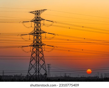 High voltage power tower industrial landscape at sunrise - Shutterstock ID 2310775409