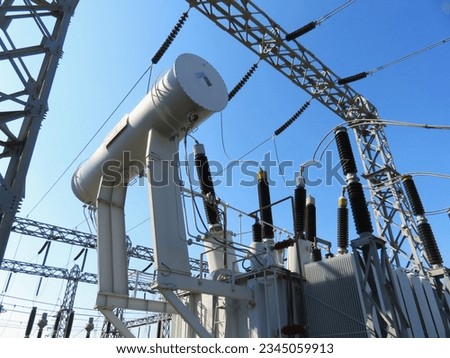 High voltage power transformer connects to air insulated power substation