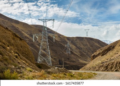 high voltage power transmission pylon in the mountains, high voltage post Mountain landscape, Kyrgyzstan