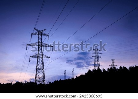 High voltage pylon overhead line at sunrise