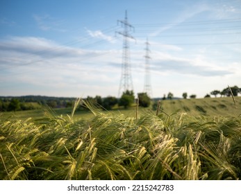 High Voltage Pylons Of An Overhead Power Line 