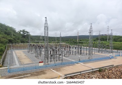 High voltage switch yard in electrical substation. Distribution, landscape.