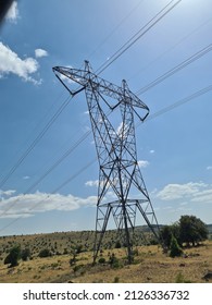 High voltage tower with the sky background. High voltage post. Selectively focused on high voltage tower.