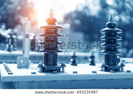 High voltage transformer with electrical insulation and electrical equipment in power substation.