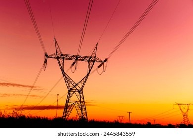 High voltage Transmission towers at the sunset - Powered by Shutterstock