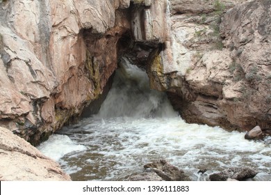 High water flows supplied by melting snows in spring rush through the rock formation known as the "Soda Dam" in Jemez Creek, in the Jemez Mountains of central New Mexico
