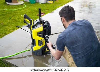 High Water Pressure Cleaner On Wet Concrete Terrace Surface. 