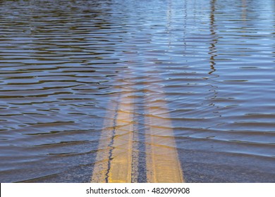 High Water Street Flooding Over Bridge