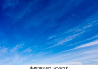 High white wispy cirrus clouds with cirro-stratus in the blue Australian sky sometimes called mare's tails indicate fine weather now but stormy changes coming within a couple of days.