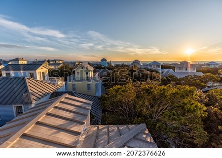 High wide angle view on sunset with ocean landscape of Gulf of Mexico in Seaside, Florida from wooden rooftop terrace buildings houses cityscape Stock photo © 