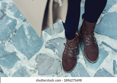 High women's shoes. Pair of boots with shoe laces. Modern youth fashion of women's casual footwear.