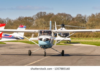 HIGH WYCOMBE, ENGLAND - MARCH 2019: Cessna Aerobat Light Trainer Aircraft With Pilot Giving A Thumbs Up Sign At Wycombe Air Park.