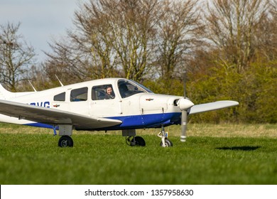 HIGH WYCOMBE, ENGLAND - MARCH 2019: Piper Warrior Light Trainer Aircraft Taxiing After Landing At Wycombe Air Park.