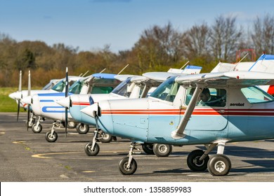 HIGH WYCOMBE, ENGLAND - MARCH 2019: Cessna Aerobat Light Trainer Aircraft Parked In A Line At Wycombe Air Park.