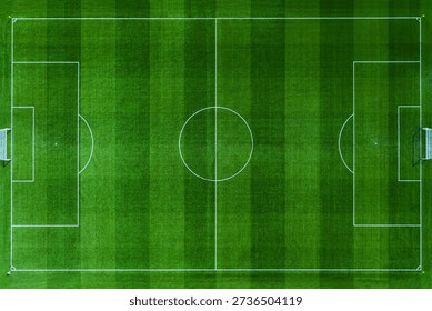High-angle aerial top view of a pristine green soccer field. Professional football pitch with white markings, goal posts, and textured grass stripes. Perfect for sports and recreation designs.