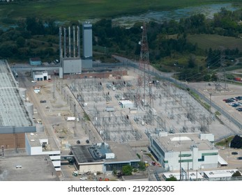 A High-angle Aerial View Looking At An Electrical Transformer, Power Grid Station. Seen On A Sunny Day.