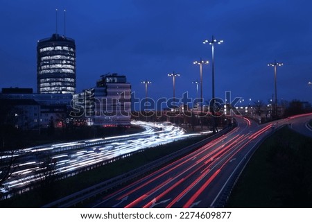 High-angle of cars in a traffic jam during evening light trails on the rouds rush hour