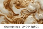 High-angle full-frame shot of coffee and milk swirling together, featuring frothy foam bubbles and creating a captivating abstract pattern. Perfect for food and beverage backgrounds.