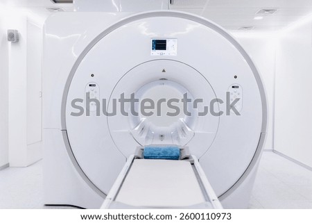 A high-angle shot of a CT scan machine room, showing the advanced medical imaging equipment and the clean, organized environment of the room. Banner, advertising, free copy space