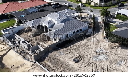 High-angle shot of a residential development featuring earthworks and pool construction in Queensland.