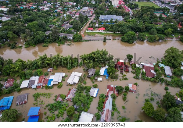 High-angle view of the Great Flood, Meng\
District, Sisaket,Ubon,Thailand, on October 3, 2022, is a\
photograph from real flooding. With a slight color\
adjustment