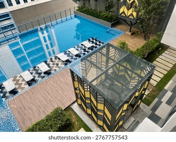 High-Angle View of Modern Infinity Pool and Geometric Pavilions