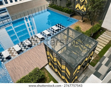 High-Angle View of Modern Infinity Pool and Geometric Pavilions
