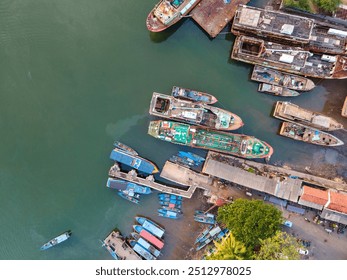 High-Angle View: Shipyard Scene with Numerous Vessels at Sunset