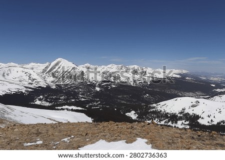 High-angle winter view looking up the snow-covered ridgeline of the Tenmile Range with Quandary Peak, Colorado, USA