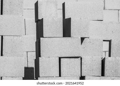 High-contrast Abstract Of Concrete Blocks Stacked On Residential Construction Site On A Sunny Morning In Florida, In Black And White. Selective Focus.