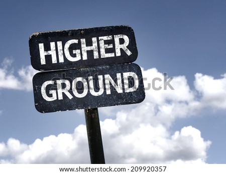 Higher Ground sign with clouds and sky background 