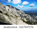 is the highest mountain in Greece. It is located in the Olympus Range on the border between Thessaly and Macedonia, between the regional units of Pieria and Larissa.