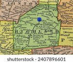 Highland County, Ohio marked by a blue tack on a colorful vintage map. The county seat is located in the city of Hillsboro, OH.
