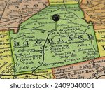Highland County, Ohio marked by a black tack on a colorful vintage map. The county seat is located in the city of Hillsboro, OH.