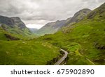 The Highlands, Scotland. Elevated drone image of a road running deep into the Grampian Mountains of the Scottish Highlands.