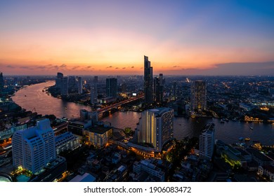 Highlight shadow in twilight at Curve of Chao Phraya River and river side view. In a main business zone of Bangkok. It's combining a contrast of buildings and  living houses.