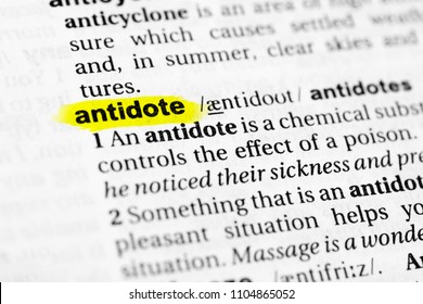 Highlighted English word "antidote" and its definition in the dictionary. - Shutterstock ID 1104865052