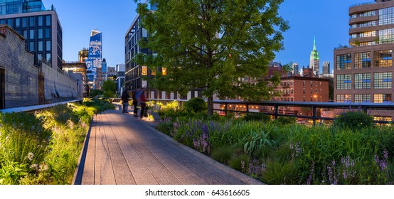Highline panoramic view at twilight with city lights, illuminated skyscrapers and high-rises. Chelsea, Manhattan, New York CIty