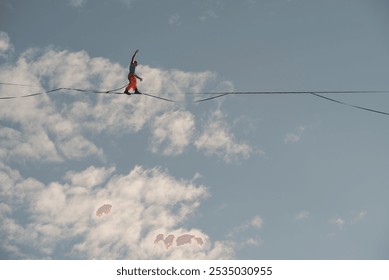 Highliner walks on a tightrope against the backdrop of the firmament. - Powered by Shutterstock