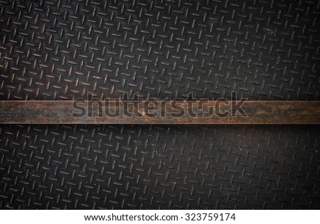 A highly detailed vintage grunge metal diamond background texture with metal bar for your text.