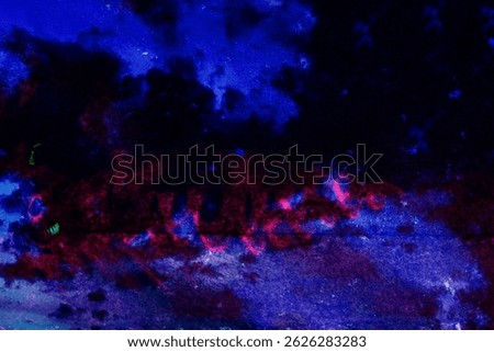 Highly stylized UV-reactive image of a painted or printed surface under blacklight. The glowing deep blue and magenta hues suggest a synthetic or acrylic-based medium. This psychedelic visual mimics
