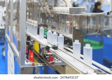 high-precision automated bottling system at work to efficiently fill and cap bottles in a streamlined process