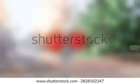 A high-quality abstract background featuring soft red circular bokeh lights against a blurred natural forest backdrop. Ideal for creative compositions, overlays, and festive design projects.