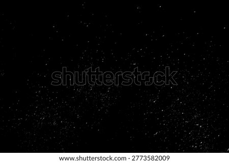 High-quality fine dust particles and subtle grain on a black background. Perfect for creating realistic atmospheric effects, vintage film looks, and clean analog photography aesthetics.