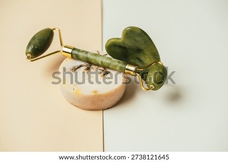 Highquality Image Showcasing Jade Roller Resting On Lavender Soap With Golden Accents